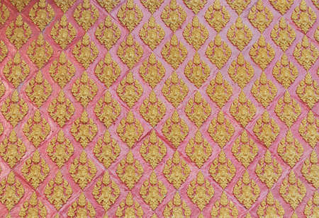 The traditional of thai painting on the wall in the  buddha templeの写真素材