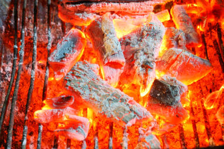 the embers blaze away in the stoveの写真素材