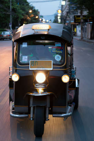 Tuk Tuk riding on the roadの素材