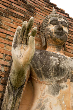 Hand of Walking Buddha statue at Sukhothai historical parkの写真素材