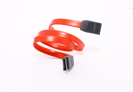 Red SATA cable isolated on a white background