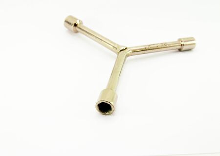 Three way wrench isolated on white background