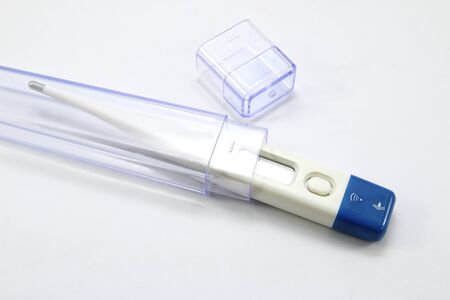 Digital thermometer with case on white background