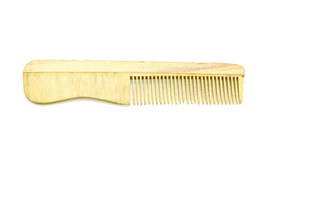 Wooden comb isolated on white background