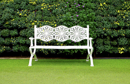 White bench in gardenの写真素材