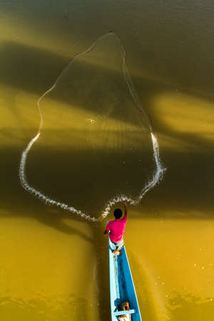 Catching the last fish of the Day の写真素材