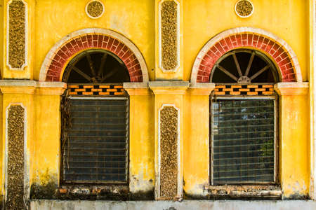 Vintage windows on old brick wallの写真素材
