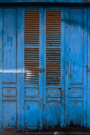 Blue wooden front door to the house