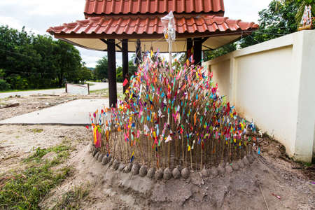 Tradition of carrying sand into the temple or monastery  Prayer flags on sand, Sakon Nakhon, Thailand の写真素材