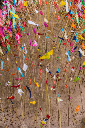 Tradition of carrying sand into the temple or monastery  Prayer flags on sand, Sakon Nakhon, Thailand の写真素材