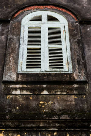 Vintage windows on old brick wall