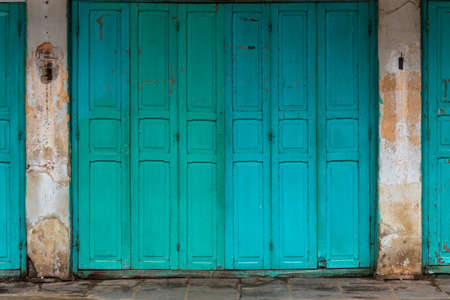 wooden front door to the house, colonial old building style at Nong Khai, Thailand.の写真素材