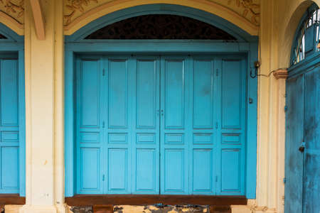 wooden front door to the house, colonial old building style at Nong Khai, Thailand.の写真素材