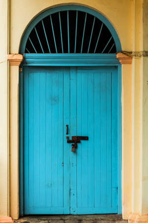 wooden front door to the house, colonial old building style at Nong Khai, Thailand.の写真素材