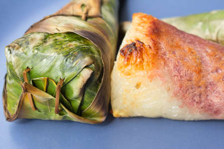 Sticky rice roast , wrapped in banana leaves.の写真素材