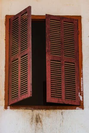 Vintage window on white cement wallの写真素材