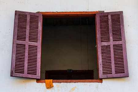 Vintage window on white cement wallの写真素材