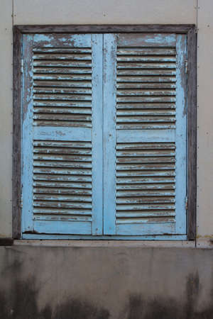 Vintage window on white cement wallの写真素材