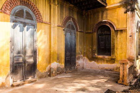 Wooden back door to the house, colonial old building style at Tharae, Sakon Nakhon, Thailand の写真素材