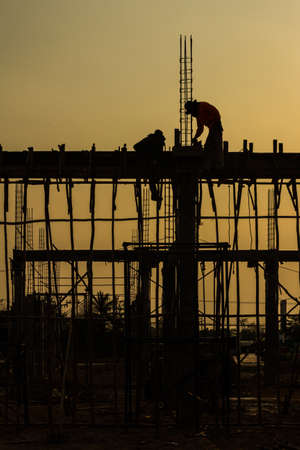 silhouette of constructionworker on constructionsiteの写真素材