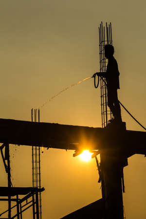 silhouette of constructionworker on constructionsiteの写真素材