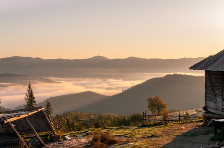 The sunrise and the view of the mountain landscape, the house among the mountainsの写真素材