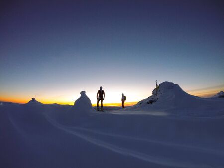 Skier skiing downhill in high mountains against sunset,Ukraineの写真素材