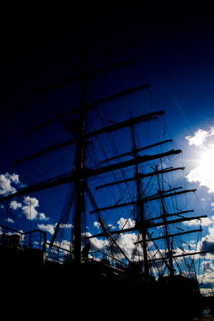 sailing-ship on the background of the sunny skyの写真素材