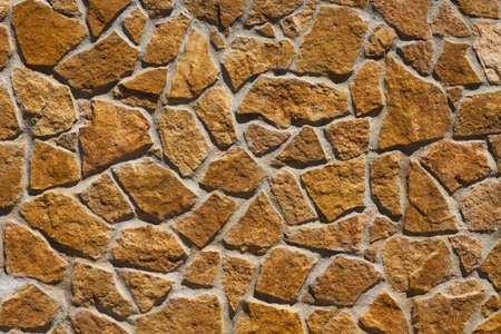 Wall made of large yellow stones