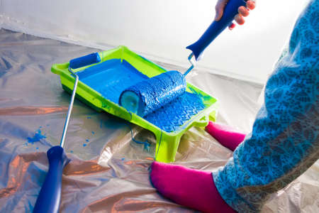 Hands working with painting rollerの写真素材