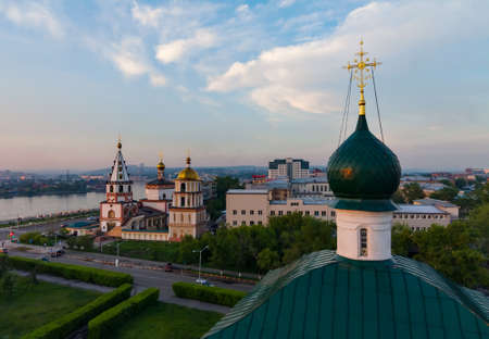Cityscape with orthodox church at sunsetの写真素材