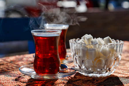 Turkish cups with hot tea and sugar