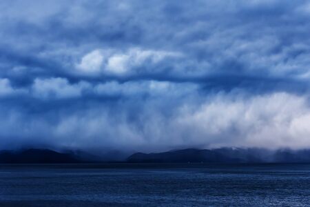 Stormy weather at Baikal lake with water and cloudsの写真素材
