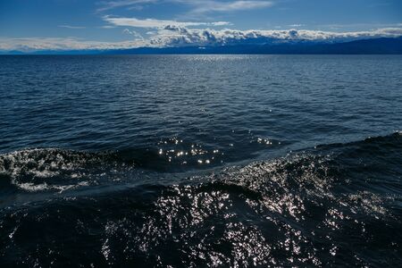 Splashes of water in Baikal lake at sunny dayの写真素材