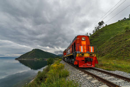 RUSSIA, ANGASOLKA - JULY 2020: Red locomotive on circum Baikal railwayのeditorial素材