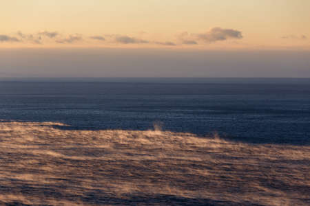 Water of Baikal lake in December with fog over waterの写真素材