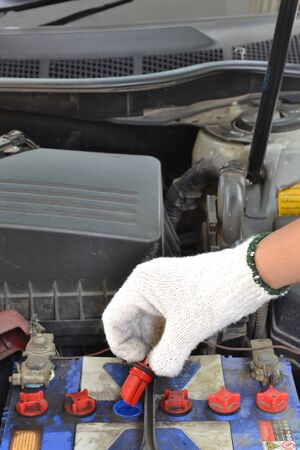 Check it on car batteries  の写真素材