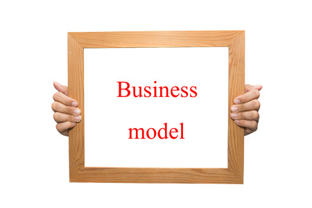 Business model on a wooden boardの写真素材