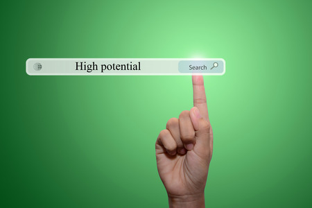business man pointing high potential concept の写真素材