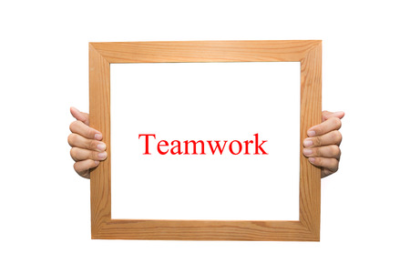 Teamwork on a wooden boardの写真素材