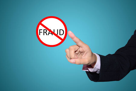 business man pointing Stop fraud sign 