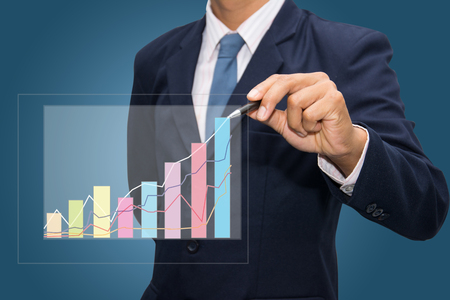 Businessman hand drawing a graph. の写真素材