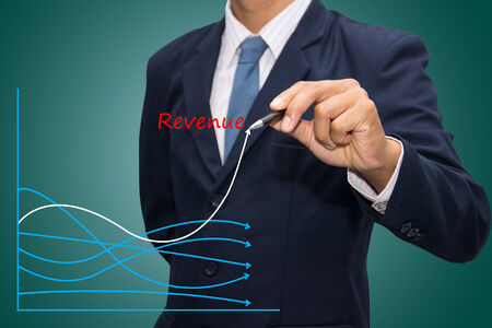 business hand writing revenue graph concept. の写真素材
