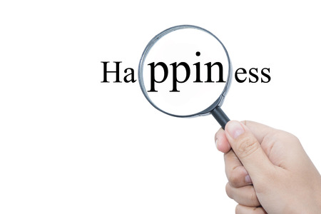 Hand Showing Happiness Word Through Magnifying Glass の写真素材