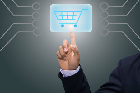 Hand pushing virtual symbol of online shopping. 