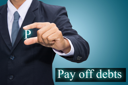 Hand holding a Pay off debtsの写真素材