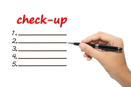 Business hand writing check-upの写真素材