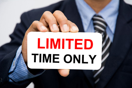 Businessman hand holding TIME ONLY conceptの写真素材