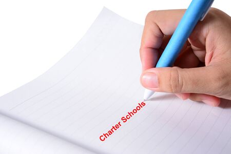 businessman hand write a Charter Schoolsの写真素材