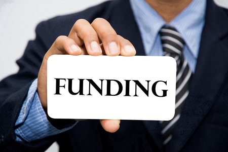 Businessman hand holding funding conceptの写真素材